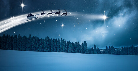 Santa Claus im Schlitten über einer Schneelandschaft bei Nacht
