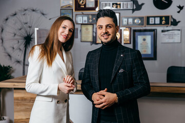 Photo of two colleagues discussing about the project in the office.