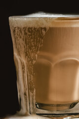 glass of coffee foam side closeup