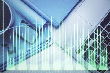 Obraz premium Double exposure of forex graph drawing over desktop background with computer. Concept of financial analysis. Top view.