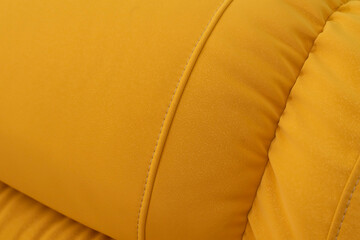 double cozy yellow fabric sofa. even seams close-up