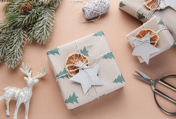 Christmas  gift boxes, clews of rope, paper's rools and decorations.