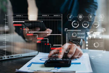 Businessman hand Project manager working and update tasks and Gantt chart scheduling virtual diagram.