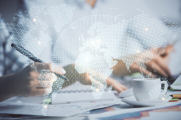 Double exposure of business theme drawing over people taking notes background. Concept of financial world