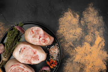 Raw pork knuckles on an abstract background, top view. - obrazy, fototapety, plakaty