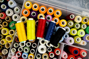 A set of colored threads for sewing, the concept of a set for needlework, top view