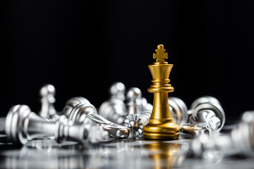 Chess game gold king stand out amongst the silver chess team. chess game strategic business...