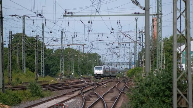 An arriving passenger train with double-decker cars to a station in Germany.