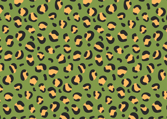 Seamless pattern. Leopard spots on a green background, fashionable leopard pattern.