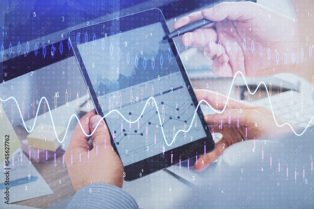 Aufkleber double exposure of man's hands holding and using a phone and financial chart drawing. market analysi