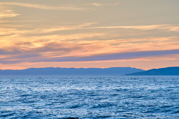 Sunset on Lake Baikal in the Barguzin Bay. Republic of Buryatia, Maksimikha settlement.