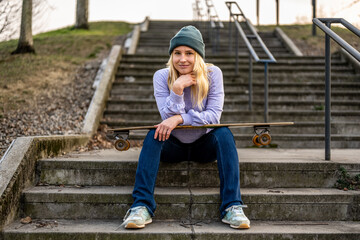 Young woman with skate, portrait of Generation Z people