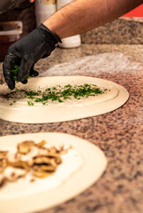 hand of chef baker making pide pizza at kitchen. The process of making pizza. cooking italian pizza