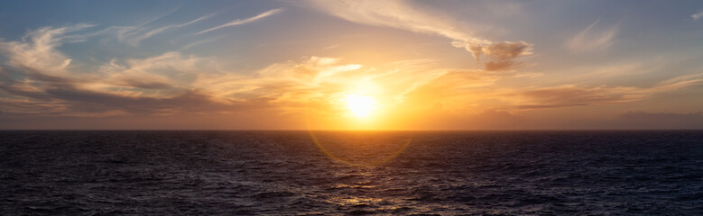 Naklejka na ściany i meble Dramatic Colorful Sunset Sky over North Atlantic Ocean. Cloudscape Nature Background. Panorama
