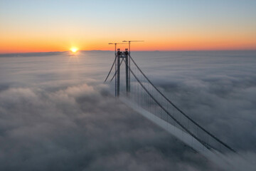 Panoramic aerial drone view from above of the suspended bridge over danube river, under...