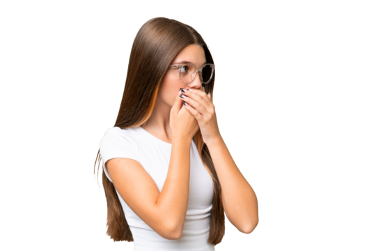 Teenager caucasian girl over isolated background covering mouth and looking to the side