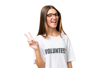 Teenager volunteer caucasian girl over isolated background smiling and showing victory sign