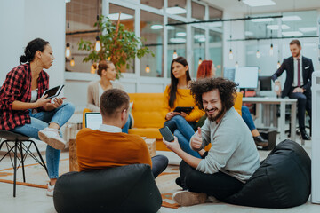 Multiethnic group of employees working in a marketing company. A group of colleagues is working on a project in modern offices