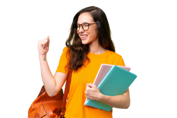 Young student caucasian woman over isolated background celebrating a victory
