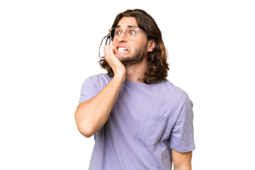 Young handsome man over isolated background is a little bit nervous