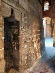 Entrance to Garisenda tower, Bologna city, Italy
