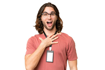 Young handsome man with ID card over isolated background surprised and shocked while looking right