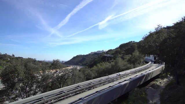 The Getty Center Railroad Tram from Lower to Upper Station on Plaza of The Getty Center. The Getty Center electric monorail arriving at the station.
