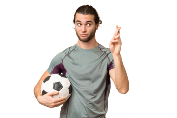 Young handsome football player man over isolated background with fingers crossing and wishing the best