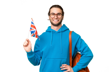 Young handsome man holding an United Kingdom flag over isolated background posing with arms at hip and smiling