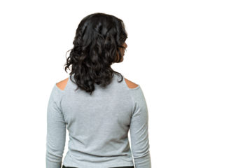 Young Argentinian woman over isolated background in back position and looking side