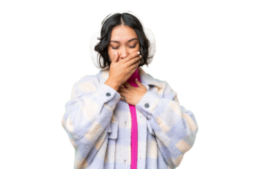 Young Argentinian woman wearing winter muffs over isolated background is suffering with cough and feeling bad