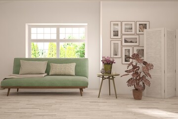 White living room with sofa and summer landscape in window. Scandinavian interior design. 3D illustration