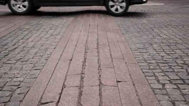Cars pass a speed bump, car suspension wears out