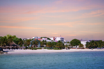 Pink sunset on the coast of Playa del Carmen, Mexico