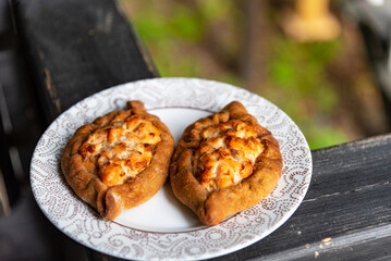 Traditional Karelian pie Kalitka. Small pies with open fillings. National food. Traditional dish of North Russian cuisine.