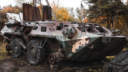 Fototapeta na wymiar War in Ukraine, damaged armored personnel carrier of the Ukrainian army, Izyum Kharkiv region