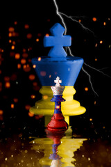 Ukraine and Russia flags paint over on cracked chess king. 3D illustration Ukraine vs Russia crisis...