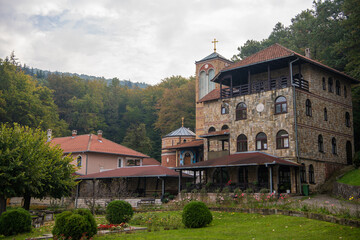 Fototapeta na wymiar Orthodox Monastery of St.Archangel (Tresije) on mountain Kosmaj, Exterior with frescoes. Sopot, Serbia 10.09.2022