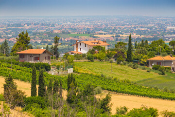 rural landscape with houses standing alone in the province of Tuscany