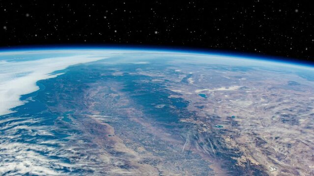 Earth from orbiting space station satellite view of California and American continent, starry space sky over horizon animation based on image by Nasa