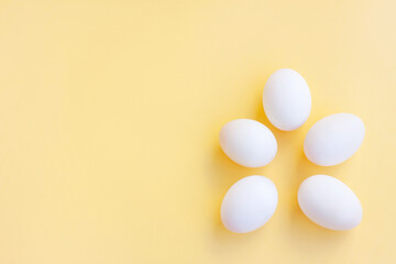 White eggs on yellow background, Duck eggs.