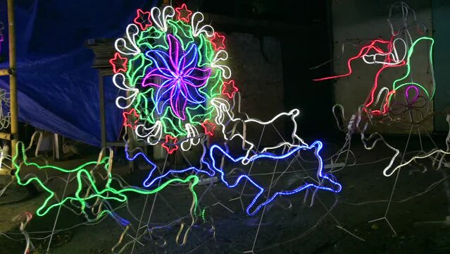 Parols for sale at a stand at nighttime. A Filipino ornamental lantern displayed during the Christmas season.
