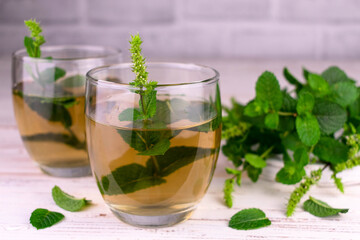 Mint tea in glasses. Useful healing drink. Close-up.
