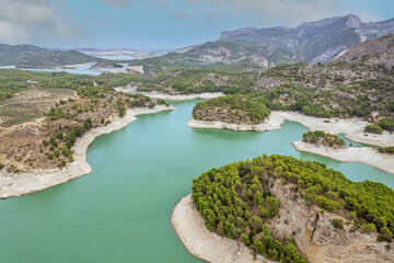 The drone aerial view of  Guadalhorce reservoir in the mountains of Andalusia in southern Spain in summer. 