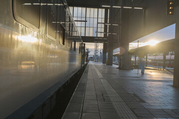 Train departure into sun
