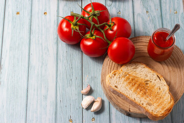 Slice of homemade bread with oil, tomato and garlic. Typical breakfast from Catalonia, Spain.