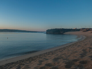 Blue hour sunrise view of Praia da Franquia sand beach at Vila Nova de Milfontes with Mira river...