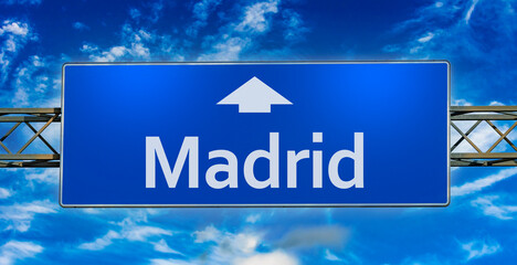 Road sign indicating direction to the city of  Madrid © monticellllo