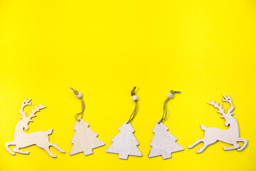 New Year's layout on a yellow background, mittens, skates, with Wooden inscription Happy New Year