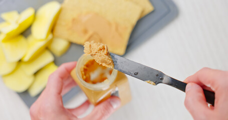 Peanut butter spread on toast bread closeup